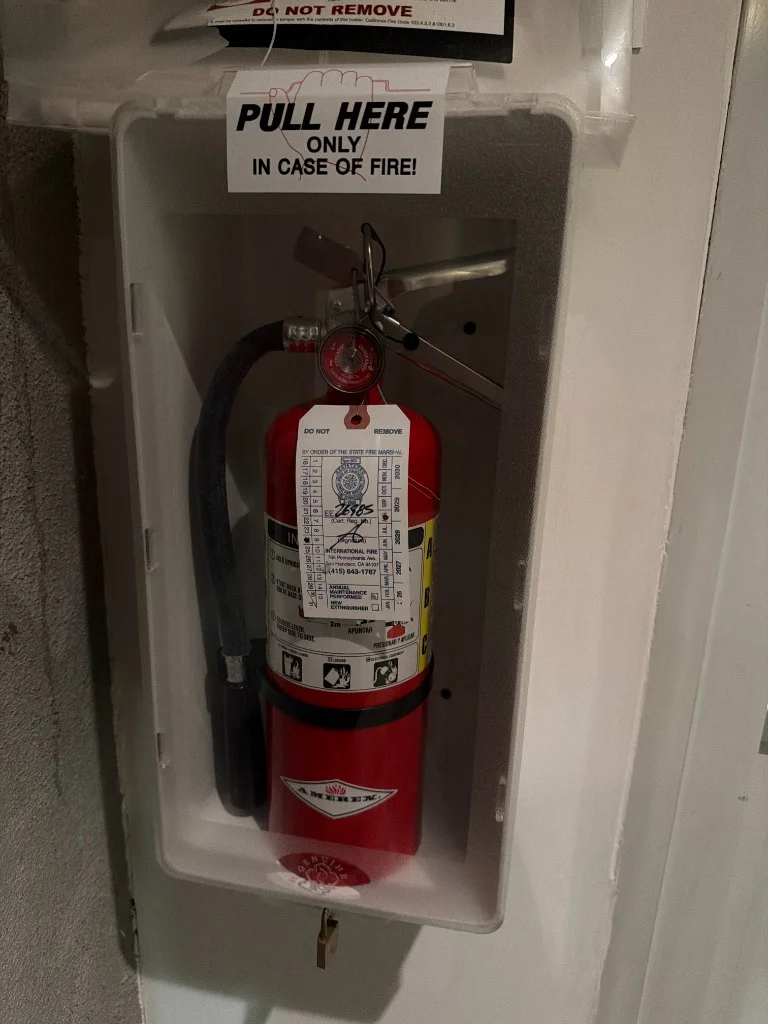 Amerex portable fire extinguisher with an updated annual maintenance tag