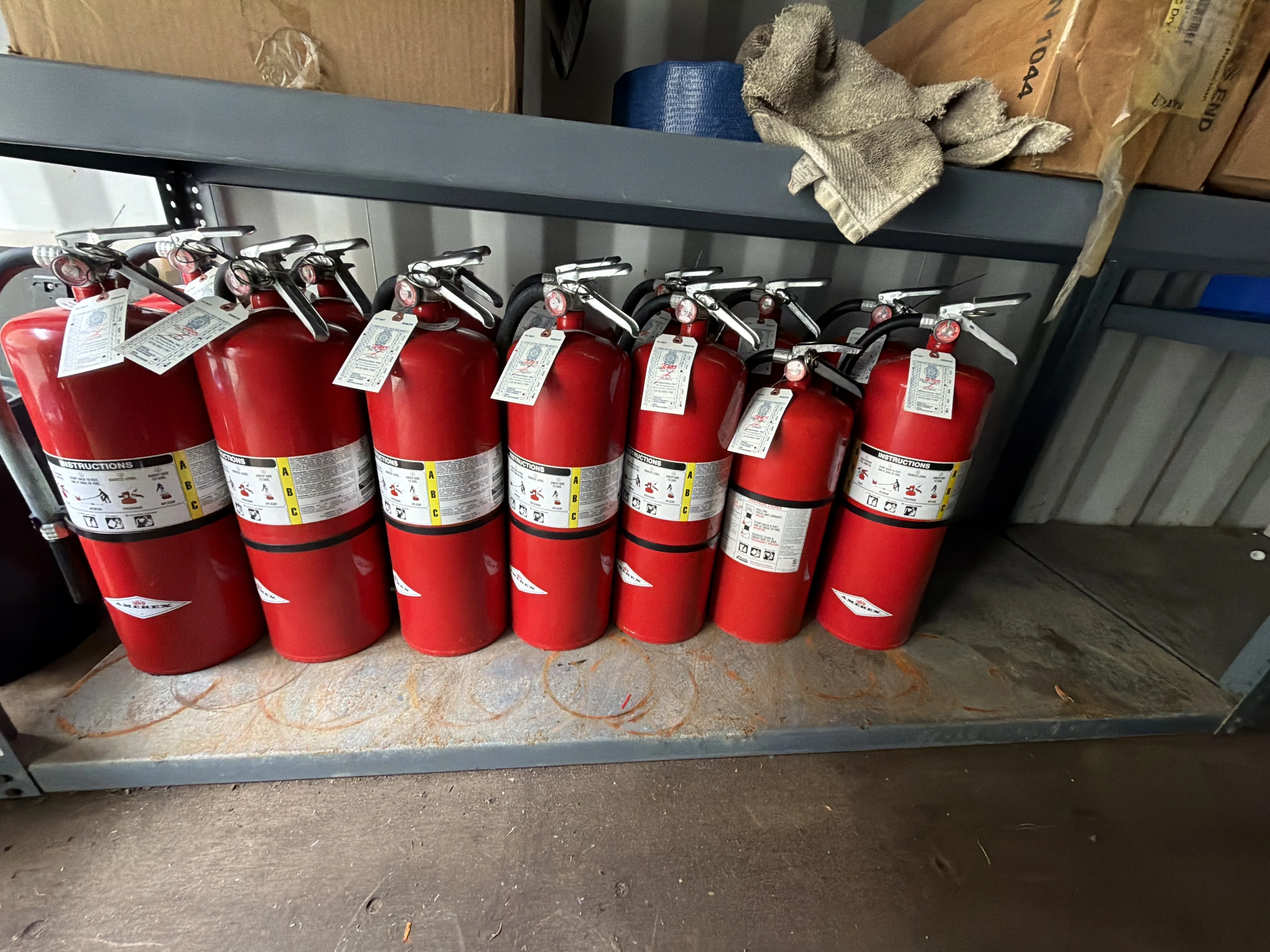 Fire extinguisher tag and bracket